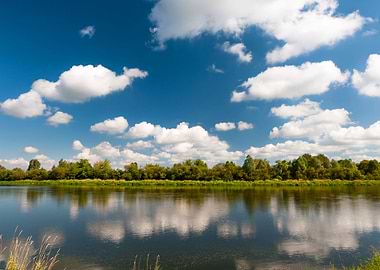River and clouds reflected