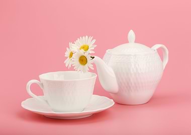 Tea set on a pink backgrou