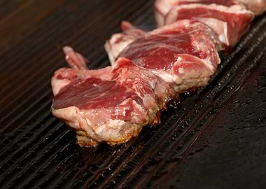 Meat baking on Greek grill