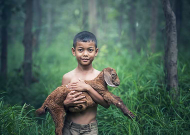 Young boy and his goat
