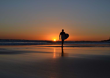 Surfing at sunset