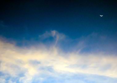 Sunbeam behind dark clouds