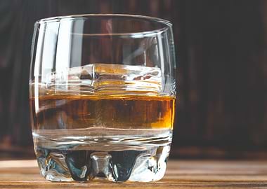 Glass of whiskey with ice