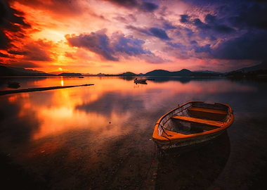 lake with wooden rowboat