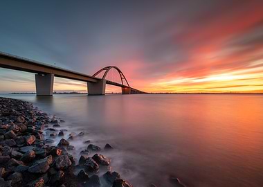 Bridge spans water sunset