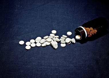 White pills glass bottle