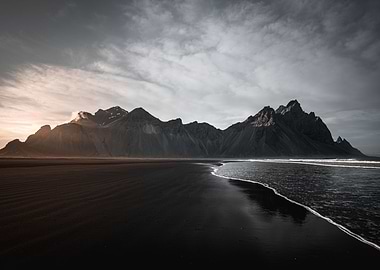 Black beach with mountains