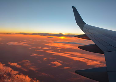 Airplane wing and sunset