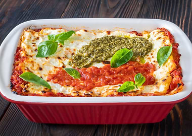 Lasagne topped with tomato