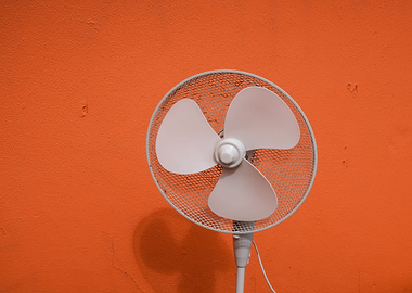 white fan orange wall