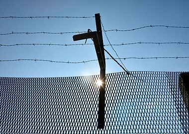 Fence with barbed wire