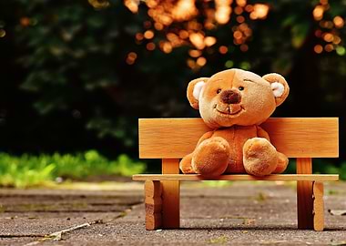 Teddy Bear on a park bench