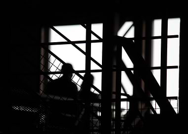 Silhouettes Through Bars