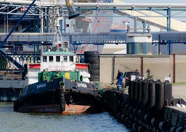 Tugboat Docked at Harbor