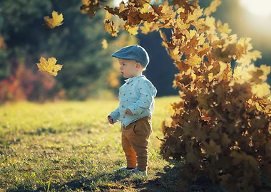 Toddler in Autumn Leaves