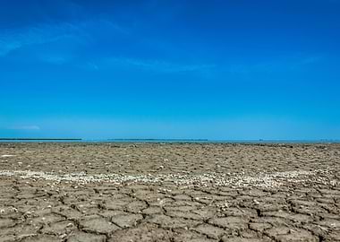 Cracked Earth Under Blue Sky