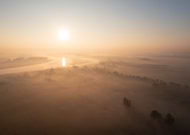 Sunrise Over Foggy River