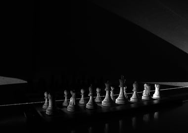 Chess Pieces Illuminated by a Laser