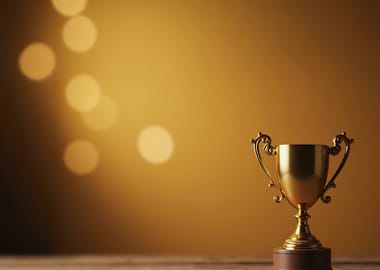 Trophy golden win shimmer bokeh copy space