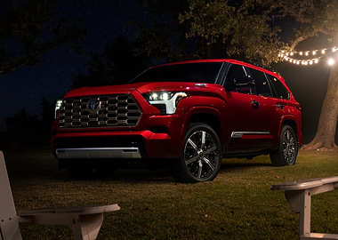 Red Toyota SUV at Night