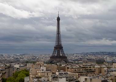 Eiffel Tower surrounded by buildings of the city of Paris
