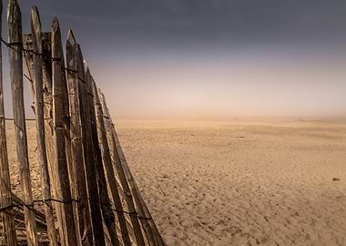 Wooden Fence on Sandy Beach