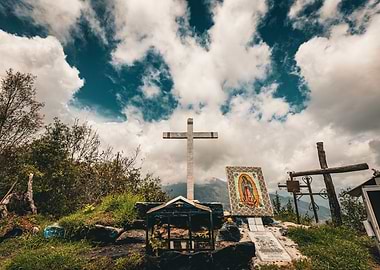 Cross and Shrine in Mountains