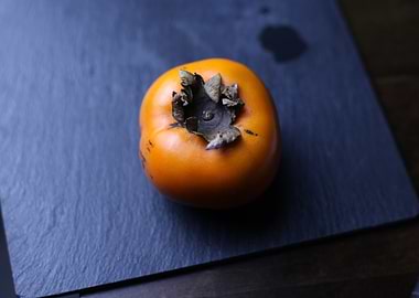 Ripe Persimmon on Slate
