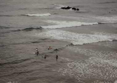 Surfers in the Ocean in Ericeira Portugal OU