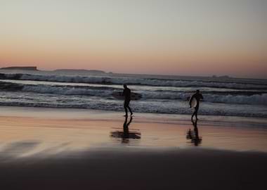 Surfers at Sunset in Peniche Portugal OU