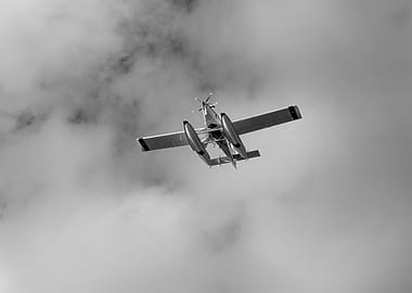 Seaplane Flying Through Clouds