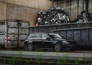 Black Mercedes C63 Wagon in Industrial area