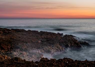 Coastal Sunset with Rocks