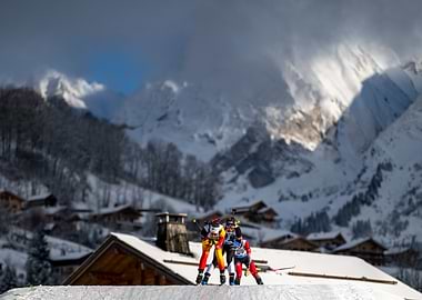 Skiers in the snow-covered mountains at the Biathlon World Cup in Le Grand Bornand