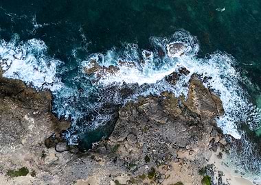 Aerial View of Ocean Waves Crashing on Rocks