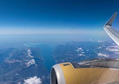 Airplane View of Mountains and Sea