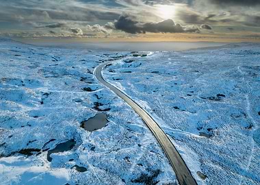 Snowy Road Through Wilderness