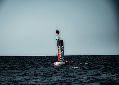 Red and White Buoy at Sea