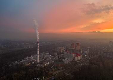 Cityscape Sunset with Smoke Stack