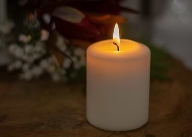 Burning Candle with Flowers