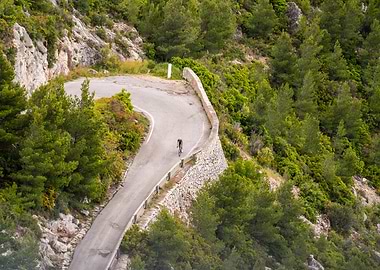 Cyclist on Winding Road