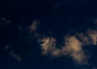 Crescent Moon in Clouds