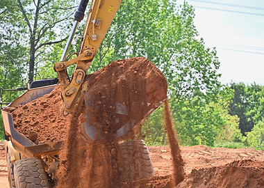Excavator Dumping Dirt