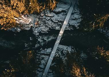 Snowy Bridge Over River