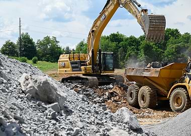 Caterpillar Excavator Loading Dump Truck