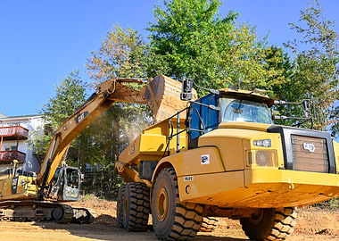 Caterpillar Excavator Loading Dump Truck