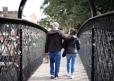 Couple Walking on Bridge