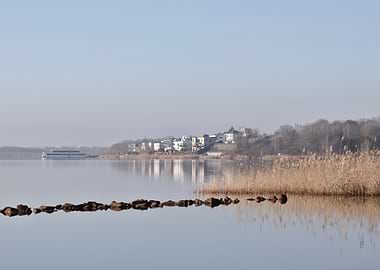 Calm Lake with Distant Houses