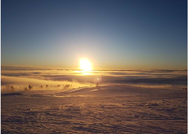 Sunset Over Snowy Landscape