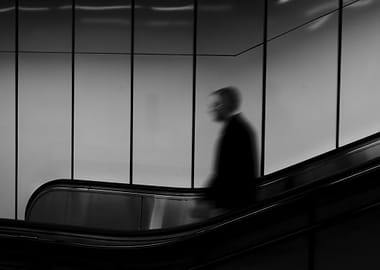 Blurred Figure on Escalator